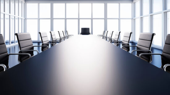 Meeting room in high-rise building with a view at the skyline - 3D illustration-shutterstock_1450471400